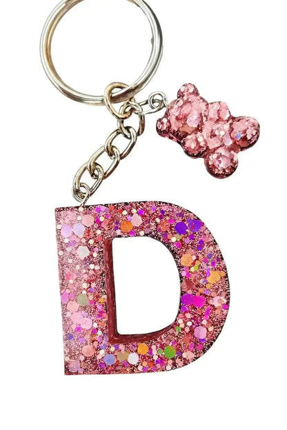 Porte-clés personnalisé famille en résine avec prénoms et fleurs séchées – création artisanale dorée Créa By Sana