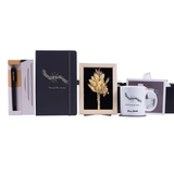 Les six pièces du coffret cadeau collaborateur personnalisé alignées sur fond blanc